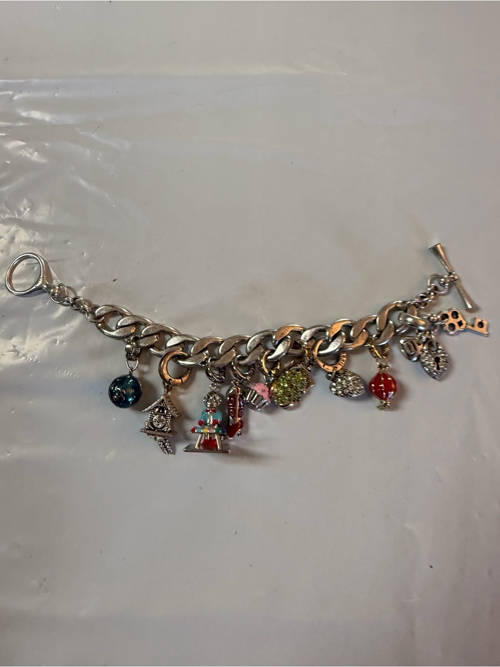Fossil Silver-Tone Multi-Charm Bracelet with Red, Green, Blue and Pink Accents